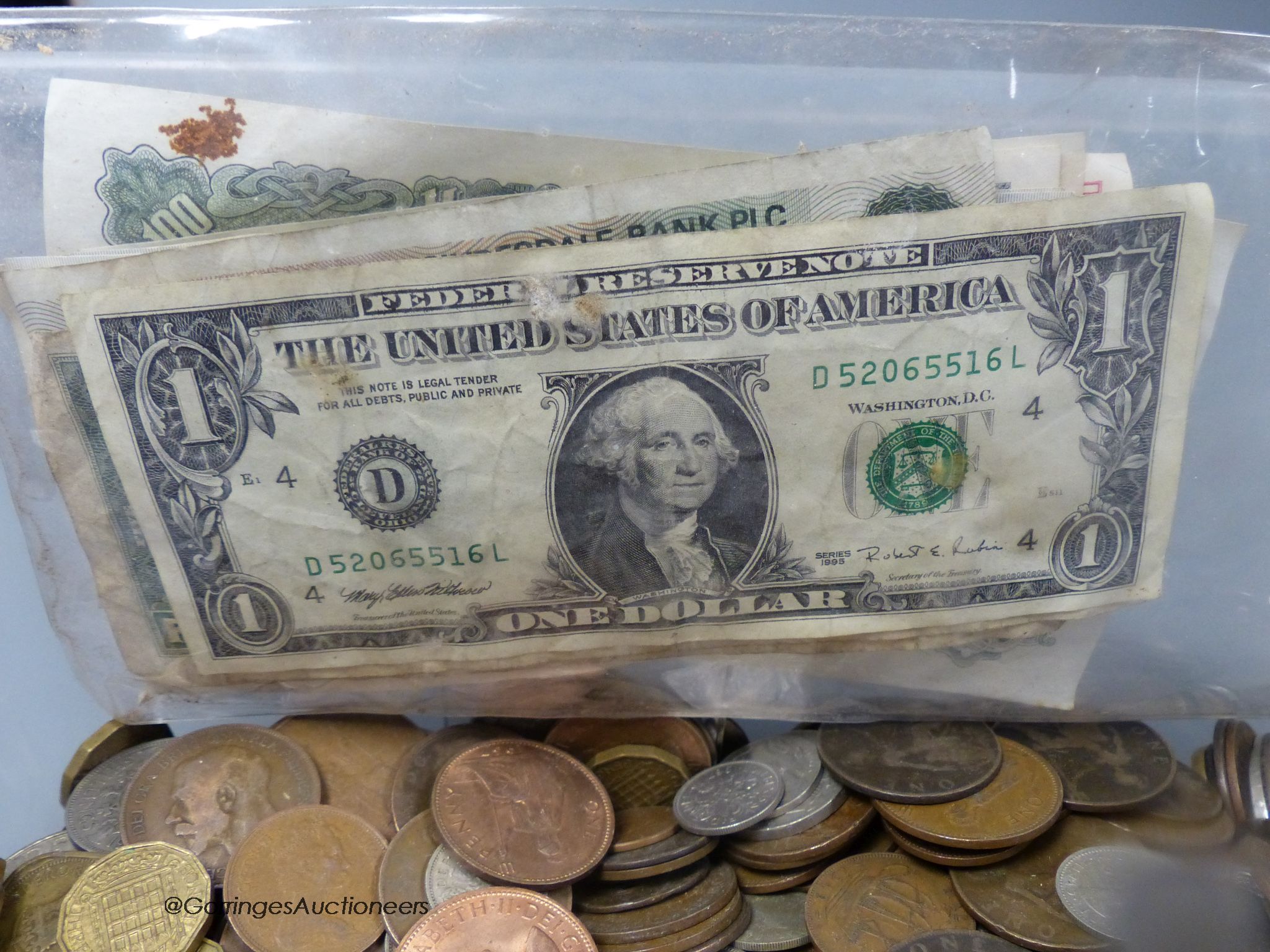 A collection of coins and bank notes